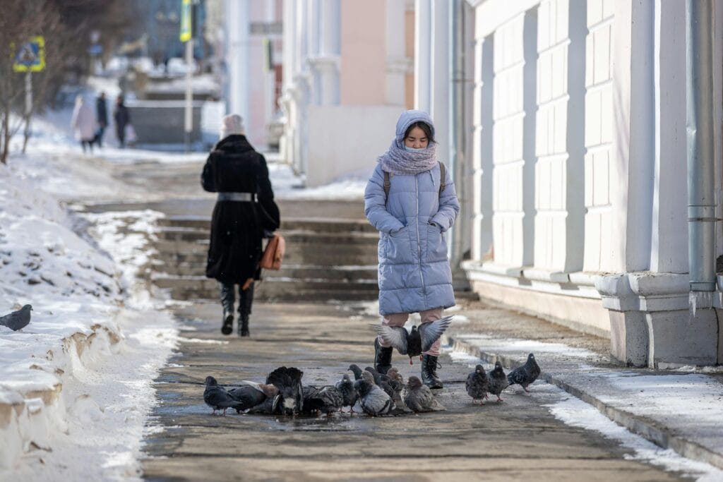 woman walking on sidewalk